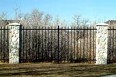 thumbnail of rodiron fencing and precast stone pillars